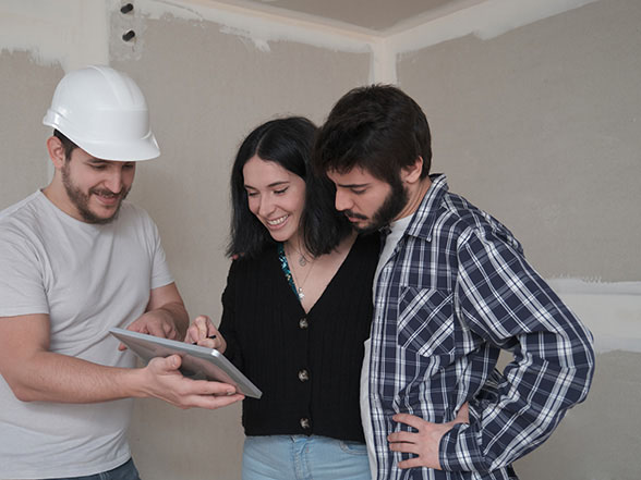 Home service remodeling consultant talking to clients about a home improvement project.